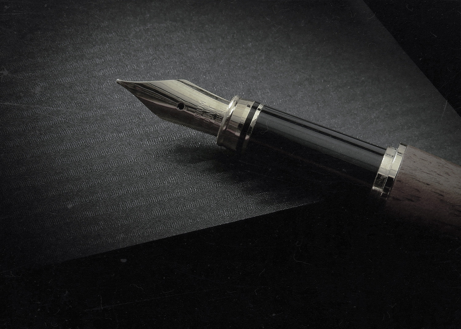 fountain pen on a dark background